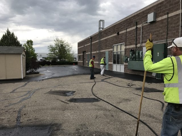 Parking lot being sealcoated