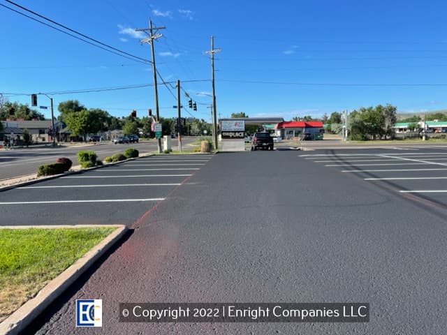 Evergreen parking lot that has just been seal coated