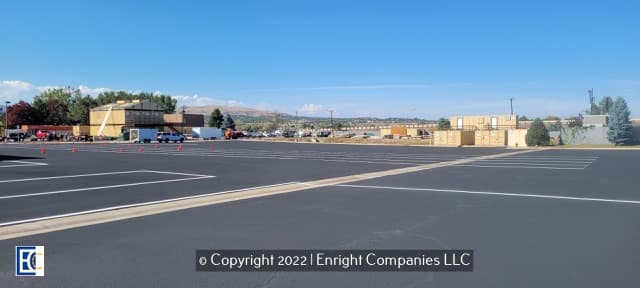 Golden parking lot with new sealcoating and striping.