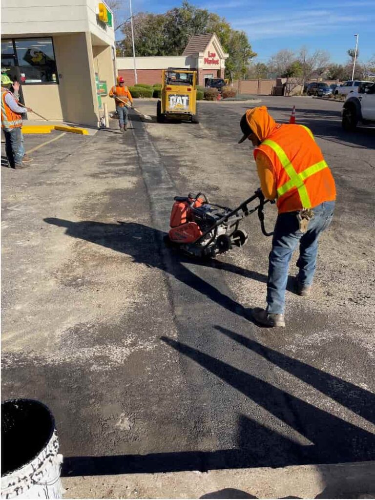 Worked compacting asphalt on pothole repair