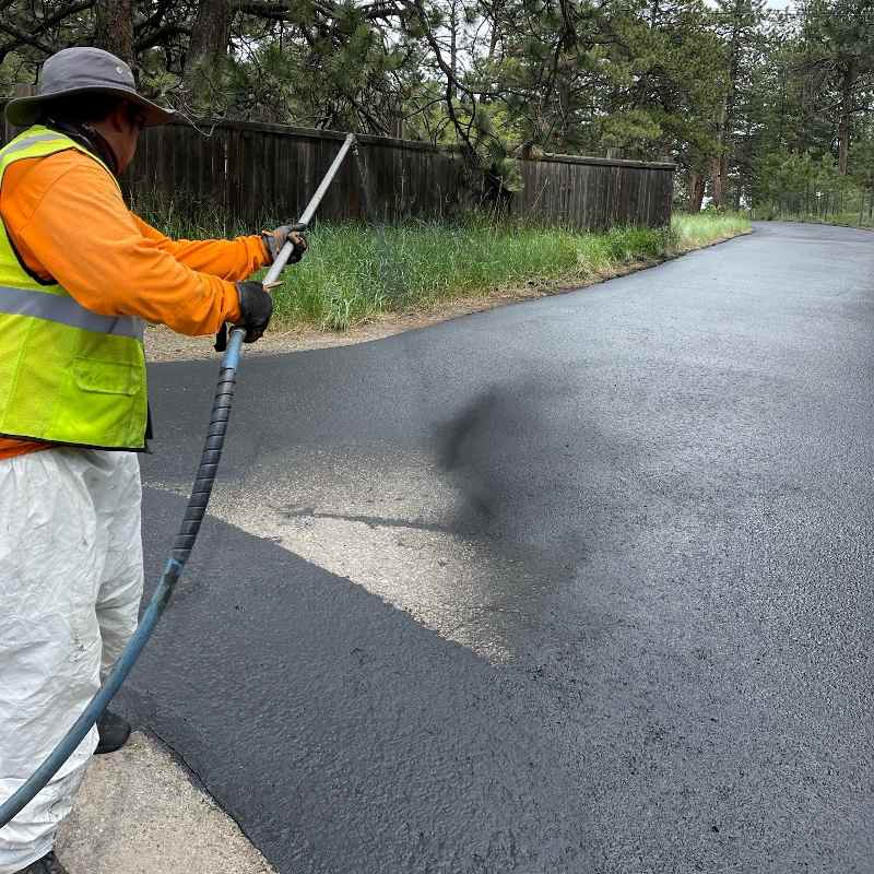 Driveway being seal coated