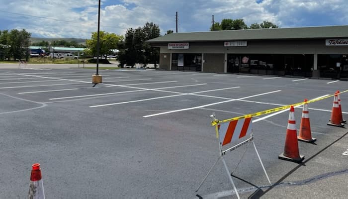 Strip mall with new parking stall painted lines