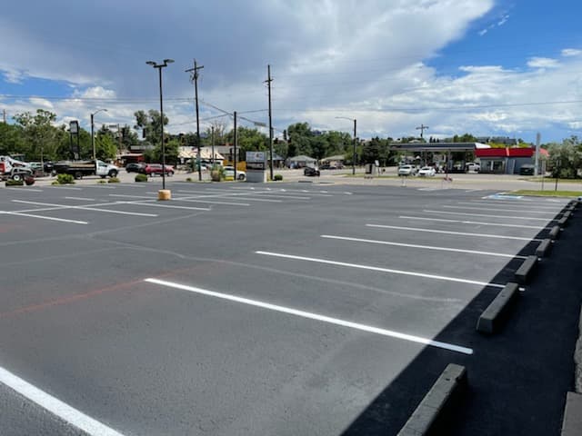 Strip Mall in Denver with new sealcoating and striping