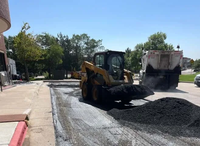 Hot Mix asphalt being placed on parking lot