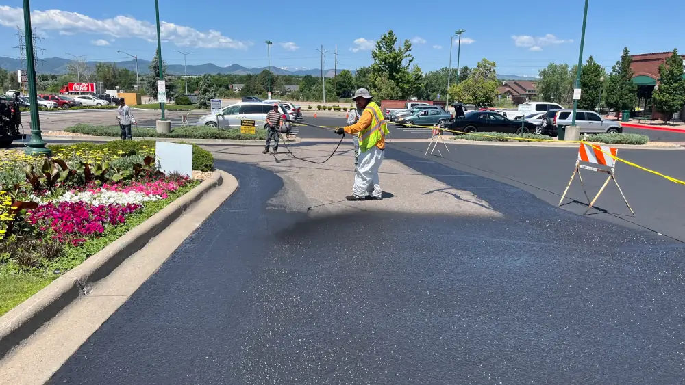 Crew laying asphalt