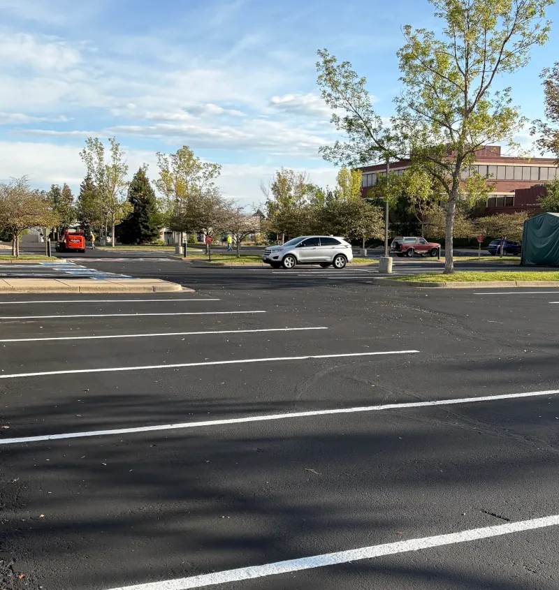 Final view of parking lot which has been sealcoated and striped