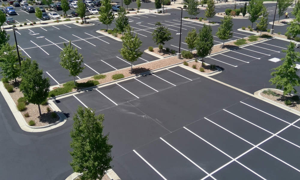 areal view of parking lot being striped
