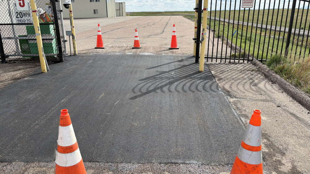 asphalt patch at entry gate