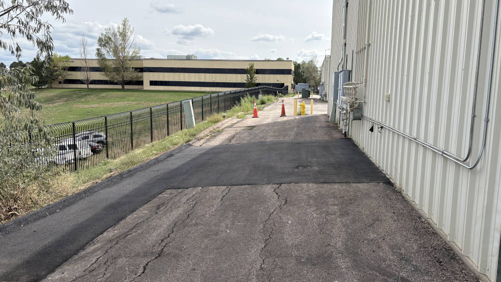 View if asphalt parking lot and curb repair