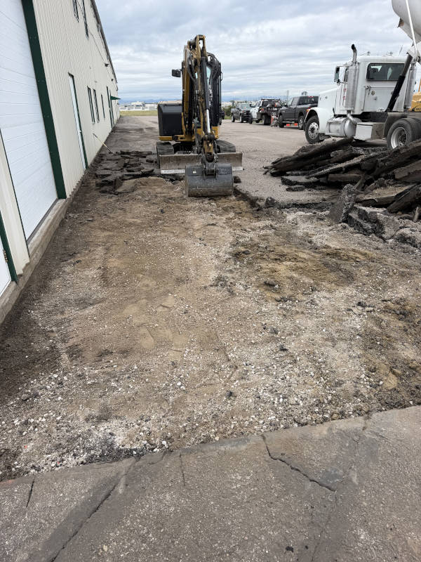Asphalt being removed and subbase being regraded